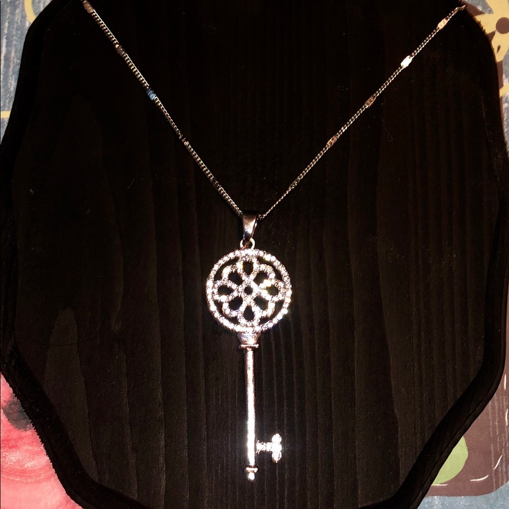 Silver necklace with key pendant